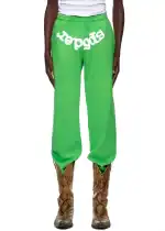 Bright green SP5DER sweatpants with bold white logo, casual streetwear style.