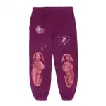 Purple sweatpants with space-themed graphics and distressed knee designs.
