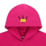 Angel Number Hoodie with Sp5der logo in yellow and black on pink fabric.