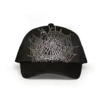 Rhinestone spider web design on black trucker cap for stylish streetwear. Perfect for fashion-forwar.
