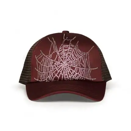 Brown trucker cap with spider web design and rhinestone accents.