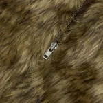 Close-up of a furry animal jacket with a zipper detail, inspired by nocturnal animals.