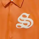 Orange leather varsity jacket with white Sp5der logo patch. Stylish and trendy streetwear for fashio.