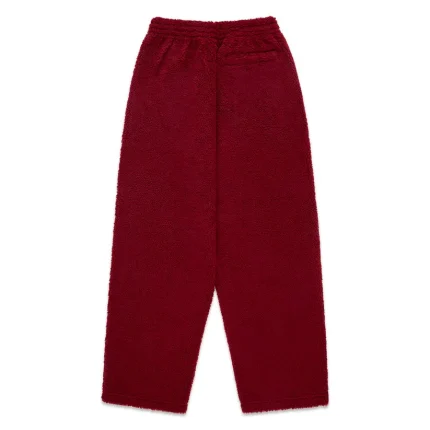 Comfortable red fleece pants for casual wear and lounging. Perfect for cozy, stylish outfits.