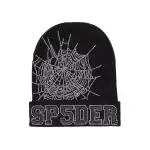 Black beanie with white spider web design and "SP5DER" logo in rhinestones.