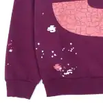 Hoodie with abstract pink and white graphic design, perfect for streetwear style.