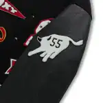 Sp5der varsity jacket leather sleeve close-up showing white hand patch with 55 embroidery and premium stitching detail
