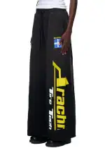 Comfortable black sweatpants with Tragi logo and flag detail for streetwear style.